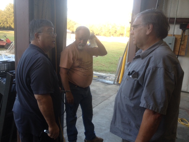 In the huddle, John on the left, Keith in the middle, Ted on the right